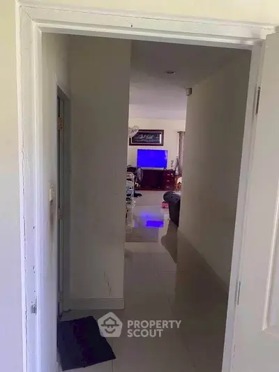 Spacious living room with modern decor and sleek tiled flooring