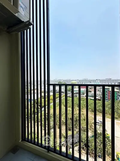Stunning balcony view with cityscape and greenery, perfect for relaxation and enjoying the outdoors.