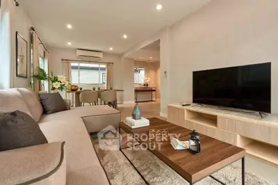 Spacious modern living room with cozy seating and elegant decor
