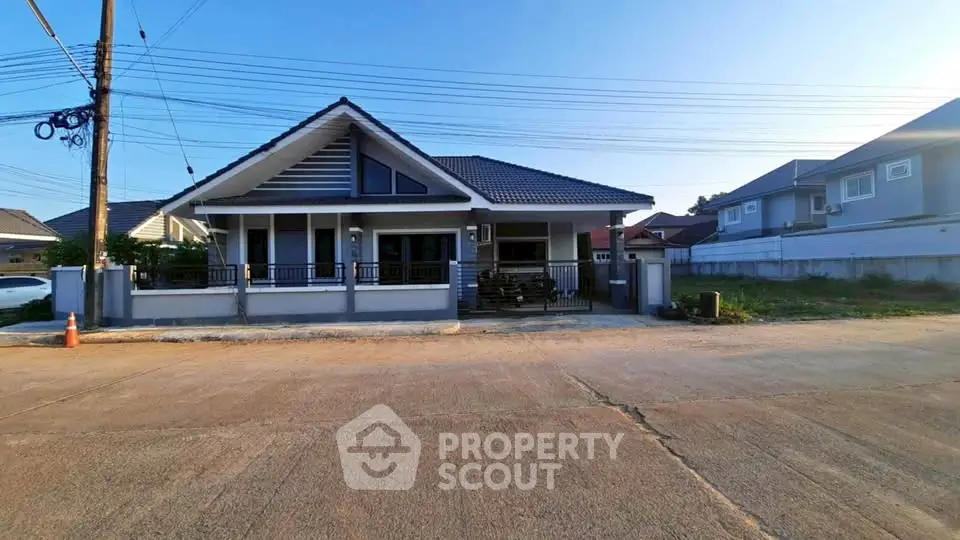 Charming single-story house with modern design and spacious front yard in a serene neighborhood.