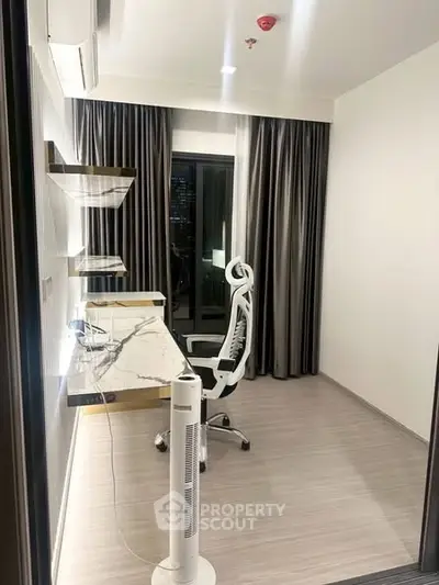 Modern study room with elegant desk and ergonomic chair, featuring floor-to-ceiling curtains and sleek flooring.