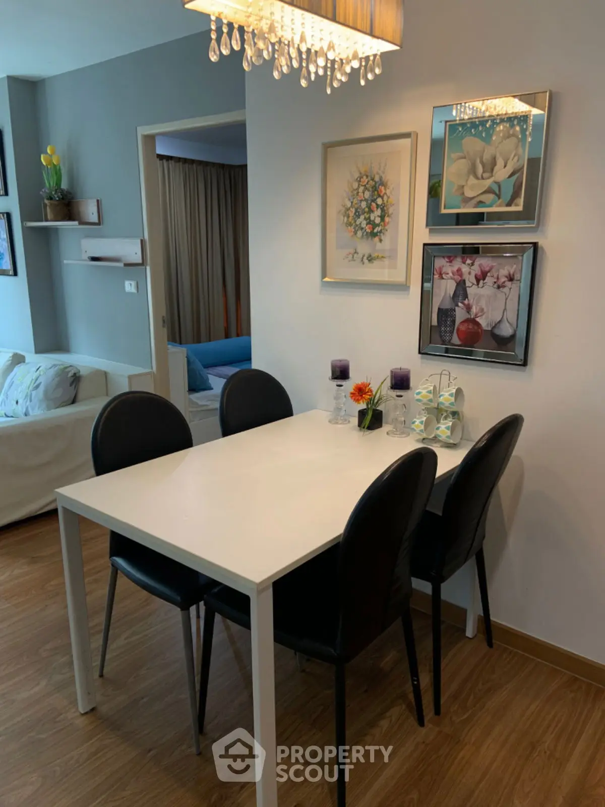 Chic dining area with modern decor and elegant lighting in a stylish apartment.