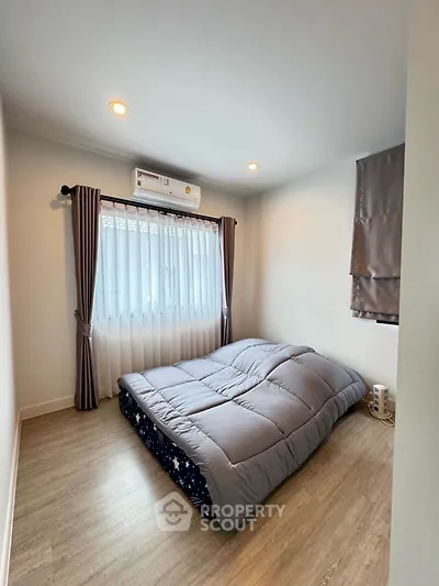 Cozy bedroom with modern decor and natural light