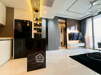 Luxurious modern living room with sleek black and white decor, featuring a stylish open kitchen and large TV.