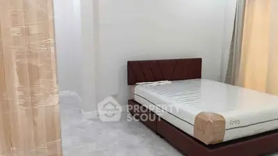 Modern bedroom with sleek design and new furnishings in a contemporary apartment.