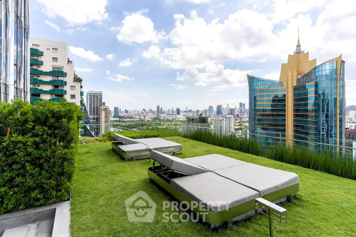 Luxurious rooftop garden with stunning city skyline view and modern lounge seating.