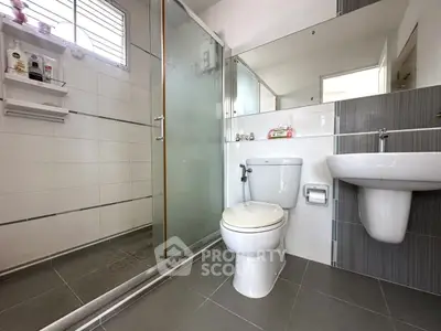Modern bathroom with glass shower and sleek fixtures