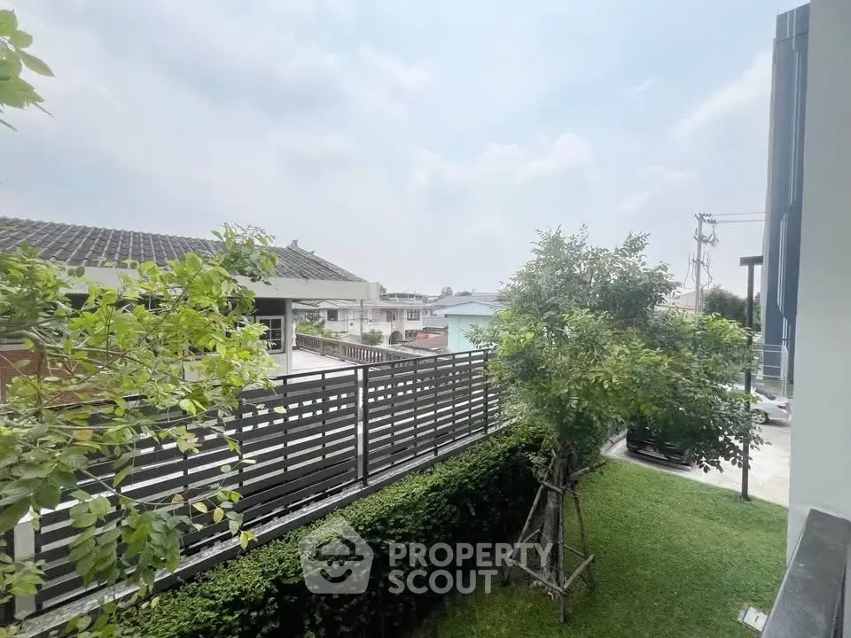Charming suburban view with lush greenery and modern architecture, perfect for serene living.
