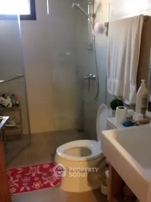 Modern bathroom with glass shower and stylish fixtures