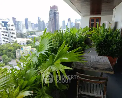 Stunning balcony with lush greenery and panoramic city skyline view
