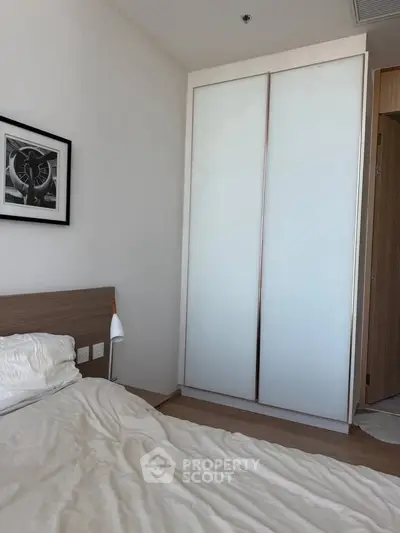 Cozy bedroom with modern wardrobe and stylish decor