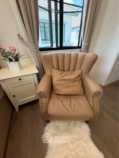 Cozy living room corner with elegant leather armchair and stylish decor