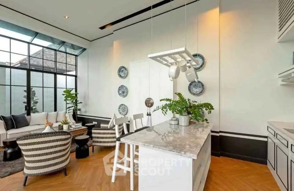Stylish modern living room with open kitchen and elegant decor