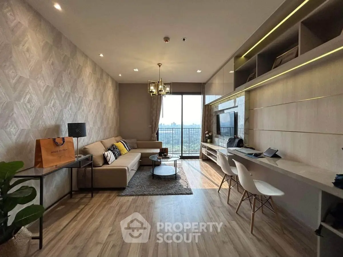 Modern living room with stylish decor and city view, featuring a cozy sofa and built-in shelving.