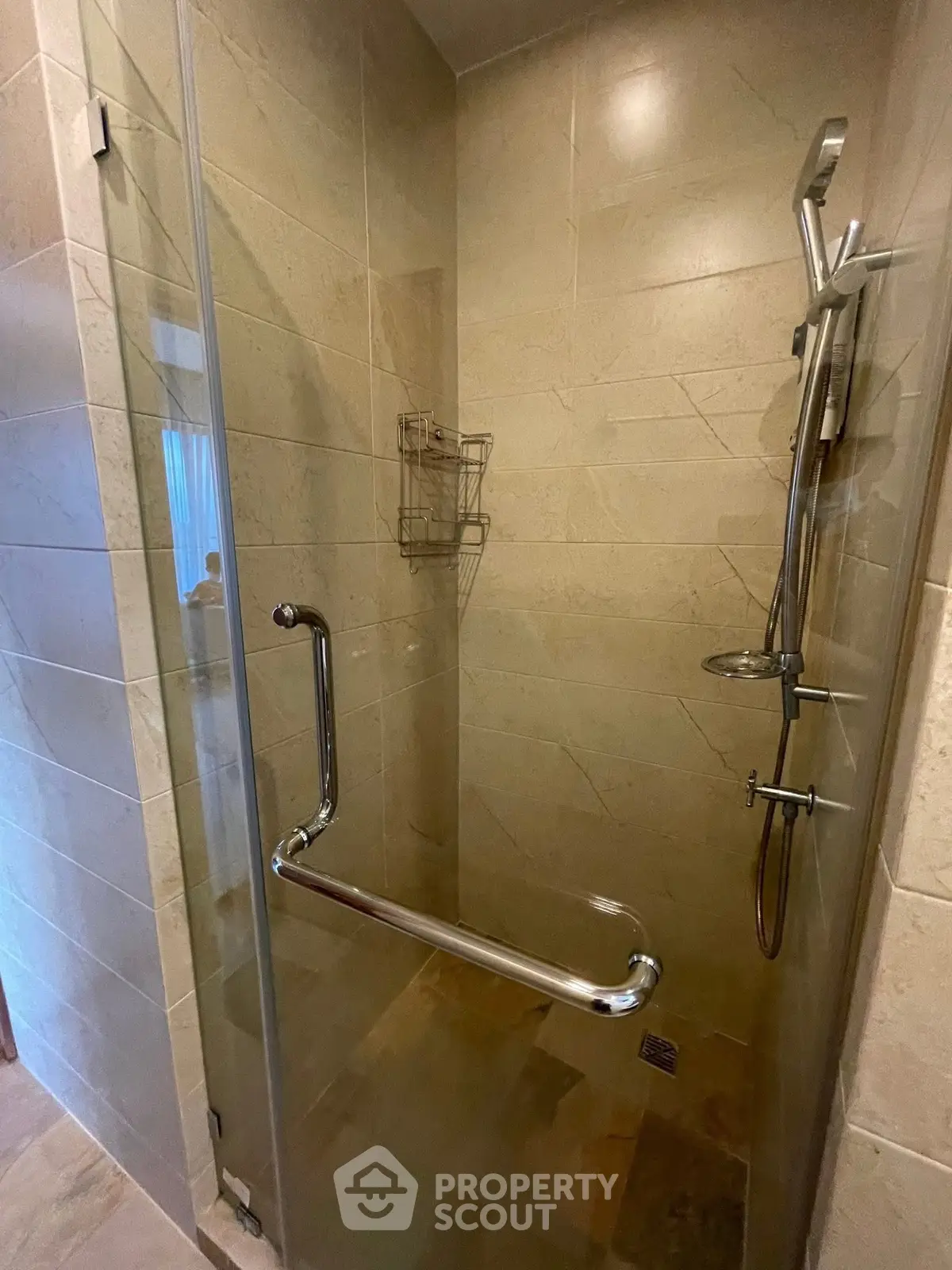 Modern bathroom shower with glass door and sleek fixtures