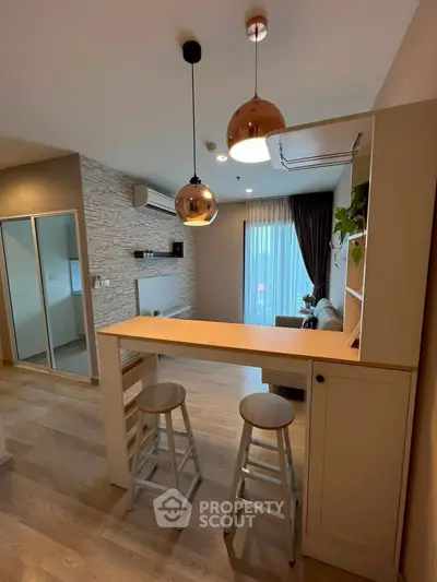 Modern living room with stylish bar counter and pendant lighting