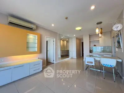 Spacious modern living room with dining area and sleek design