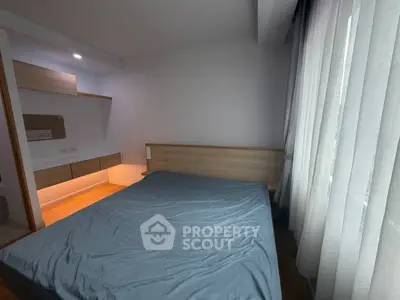 Cozy bedroom with modern wooden furniture and soft lighting, perfect for relaxation and comfort.