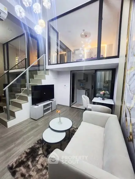 Modern duplex living room with stylish decor and mezzanine level