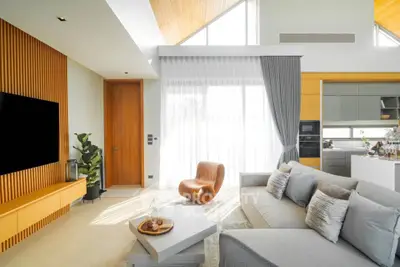 Modern living room with stylish decor and open kitchen layout