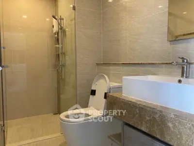 Modern bathroom with sleek design and glass shower enclosure