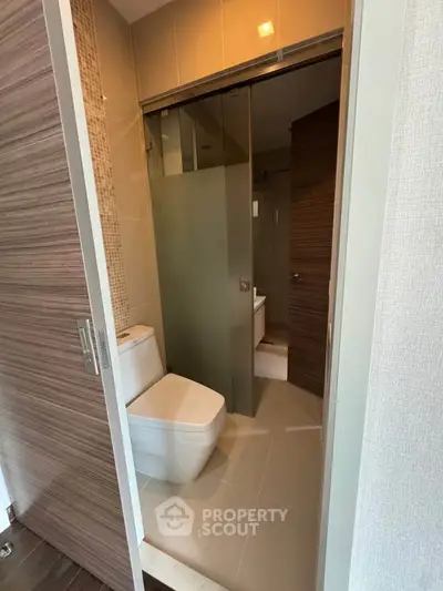 Modern bathroom with sleek design and glass shower enclosure