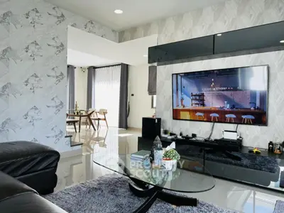 Modern living room with sleek design and open dining area