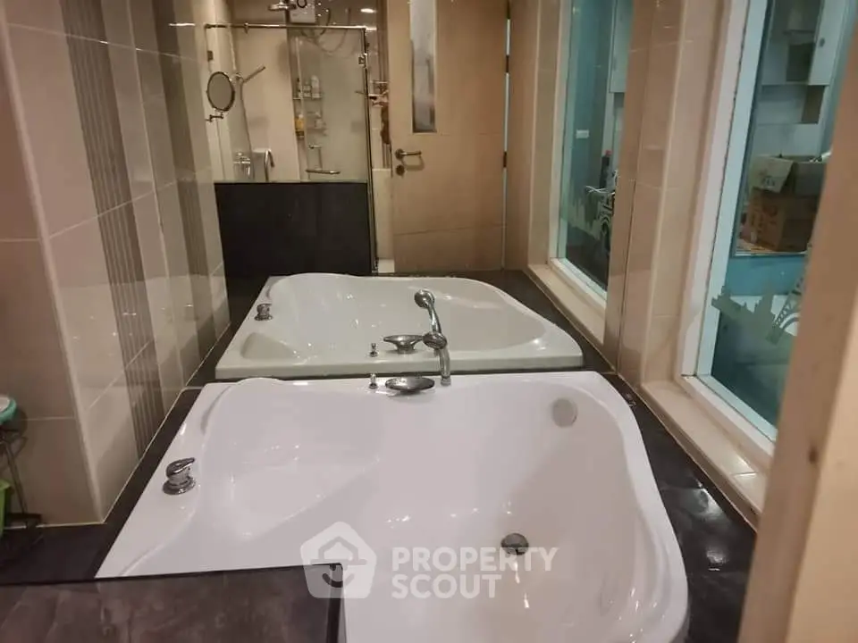 Luxurious bathroom with modern bathtub and elegant fixtures, perfect for relaxation and comfort.