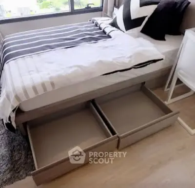 Modern bedroom with storage drawers under bed and stylish decor