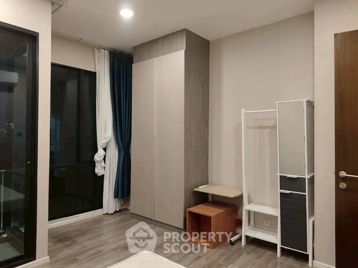 Modern bedroom with sleek wardrobe and minimalist decor