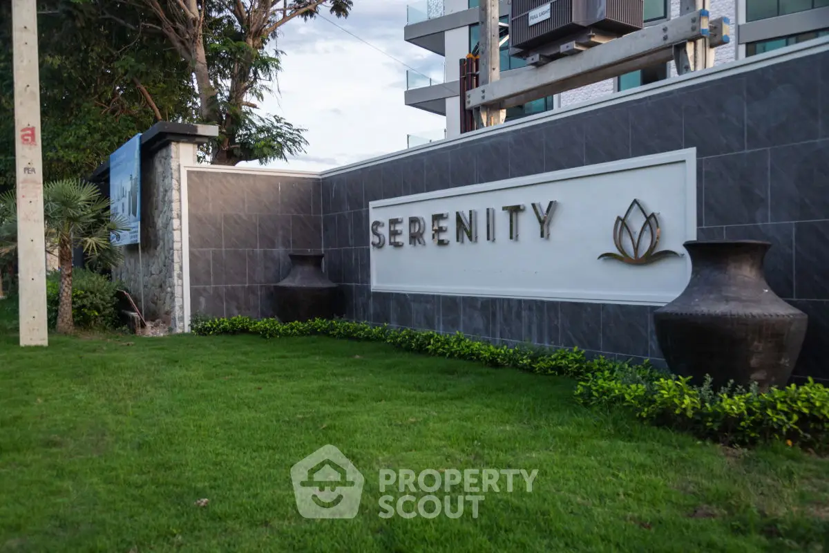 Elegant entrance sign of Serenity with lush greenery and modern design.