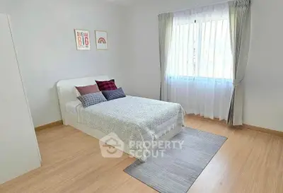 Bright and cozy bedroom with modern decor and natural light