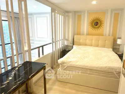 Luxurious bedroom with elegant decor and large windows offering city views.