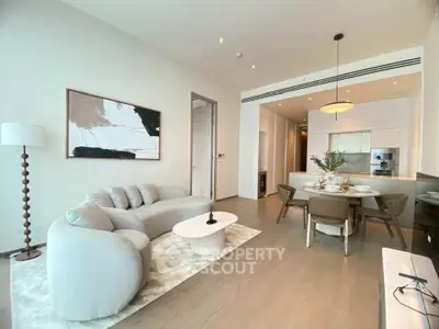 Modern open-plan living room with elegant dining area and stylish decor