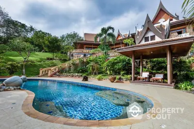 Luxurious tropical villa with stunning pool and lush garden landscape.