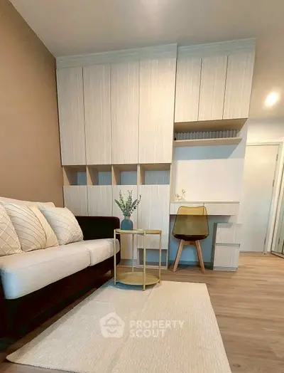 Modern living room with stylish furniture and built-in storage