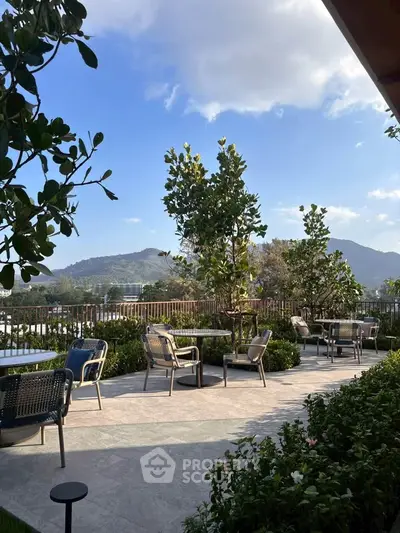 Stunning outdoor terrace with mountain views and elegant seating area.