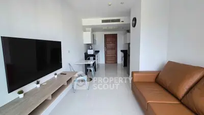 Modern living room with sleek furniture and open kitchen layout