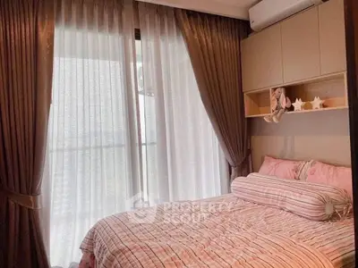 Cozy bedroom with elegant curtains and plush bedding in a modern apartment.