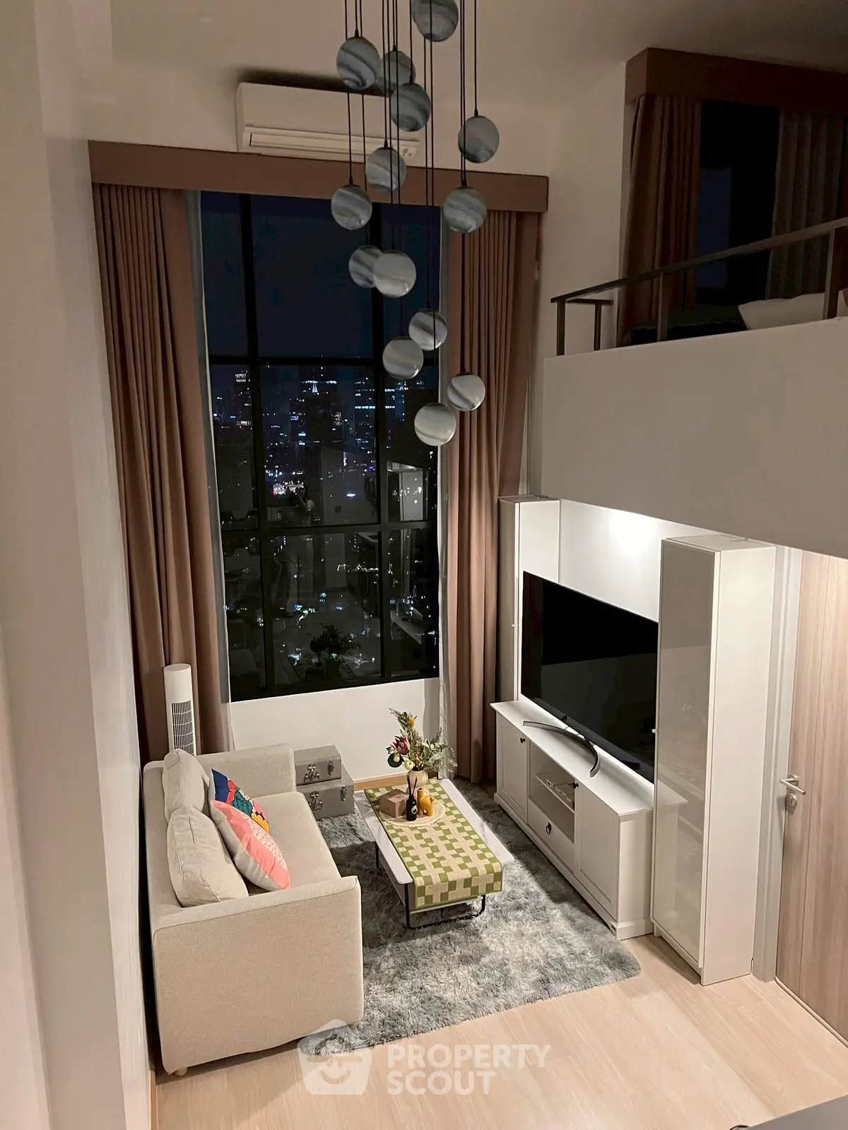 Luxurious high-ceiling living room with city view, modern decor, and elegant lighting.