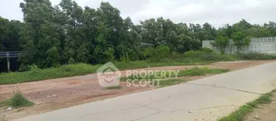 Spacious land plot with lush greenery, ideal for development or investment opportunities.