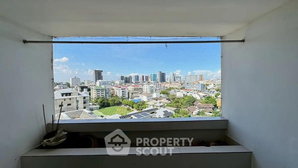 Stunning cityscape view from a high-rise balcony, perfect for urban living enthusiasts.