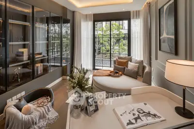 Luxurious living room with elegant decor and large windows overlooking a garden view.