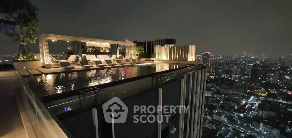 Luxurious rooftop pool with stunning city skyline view at night