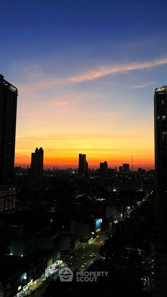 Stunning city skyline view at sunset with vibrant colors and high-rise buildings.