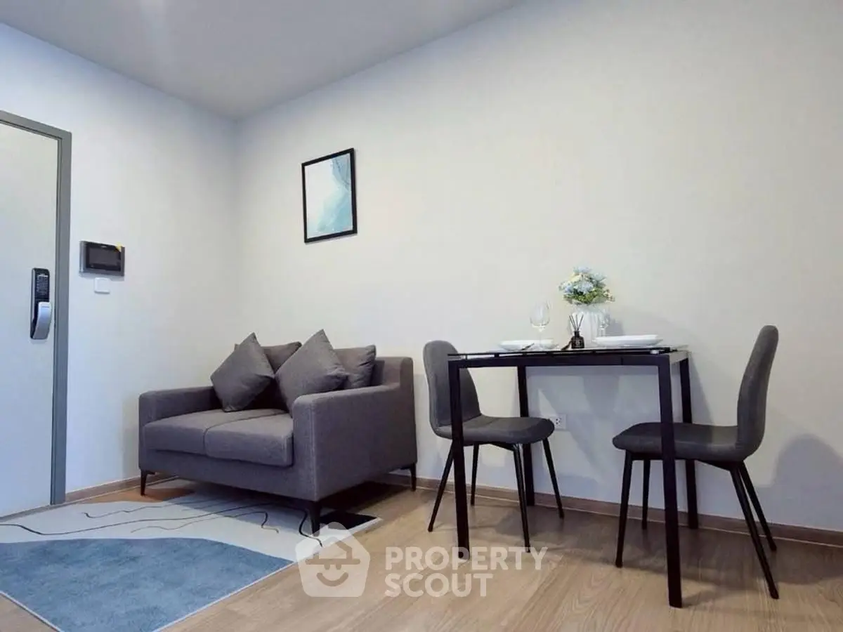 Modern living room with cozy sofa and dining area in stylish apartment.