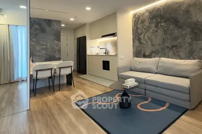 Modern living room with stylish decor and open kitchen layout