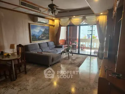 Spacious living room with elegant decor and balcony view in luxury apartment