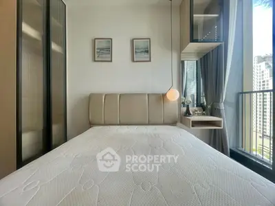 Modern bedroom with balcony view in high-rise apartment