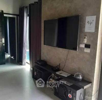 Modern living room with wall-mounted TV and stylish decor